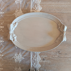 Beige wooden tray with bows